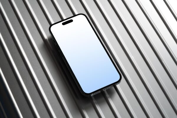 Side view of iPhone 14 Pro on Rimowa aluminum luggage.