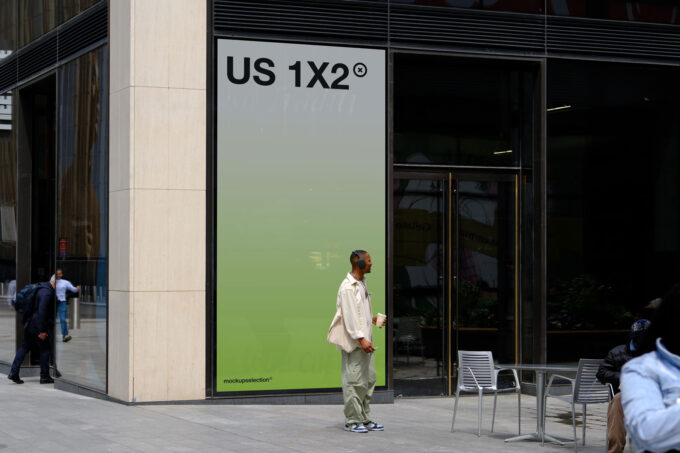 1x2 storefront billboard in an urban environment with a person in front.