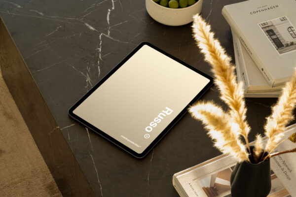 iPad Pro mockup displayed on a black marble table in a luxury apartment.